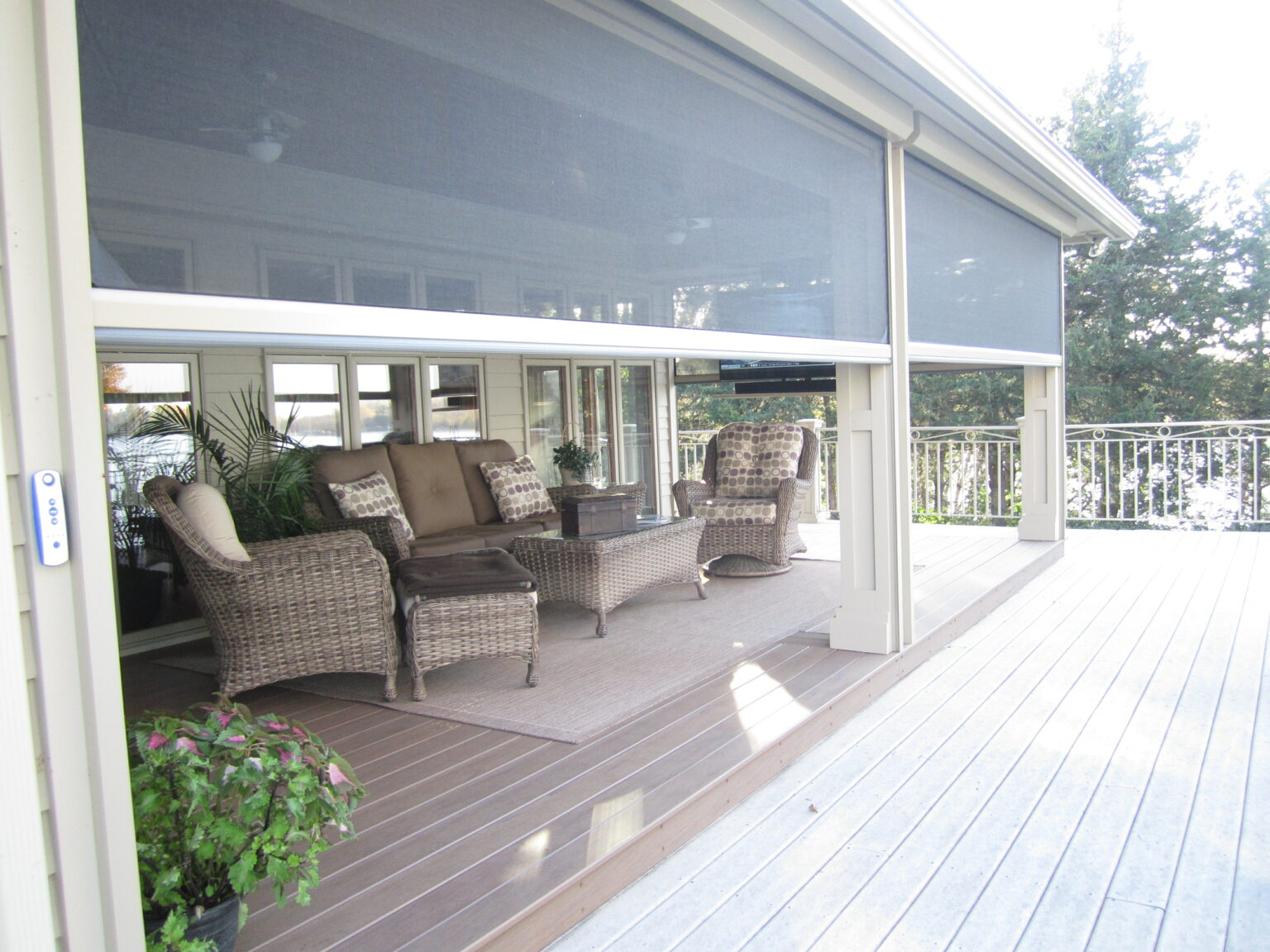 House exterior remodel from patio and deck builders with closable shades in Minnesota. 