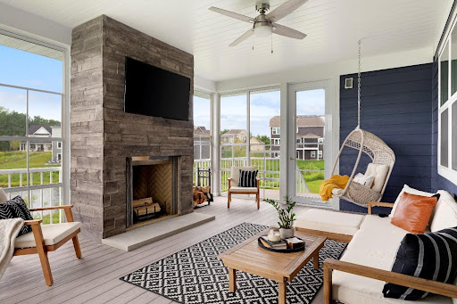 Stone fireplace in a neatly finished 3 season porch