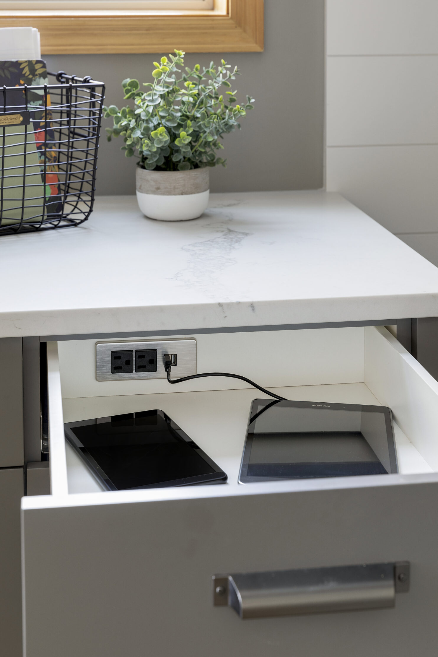 Tablets with an outlet in a drawer.