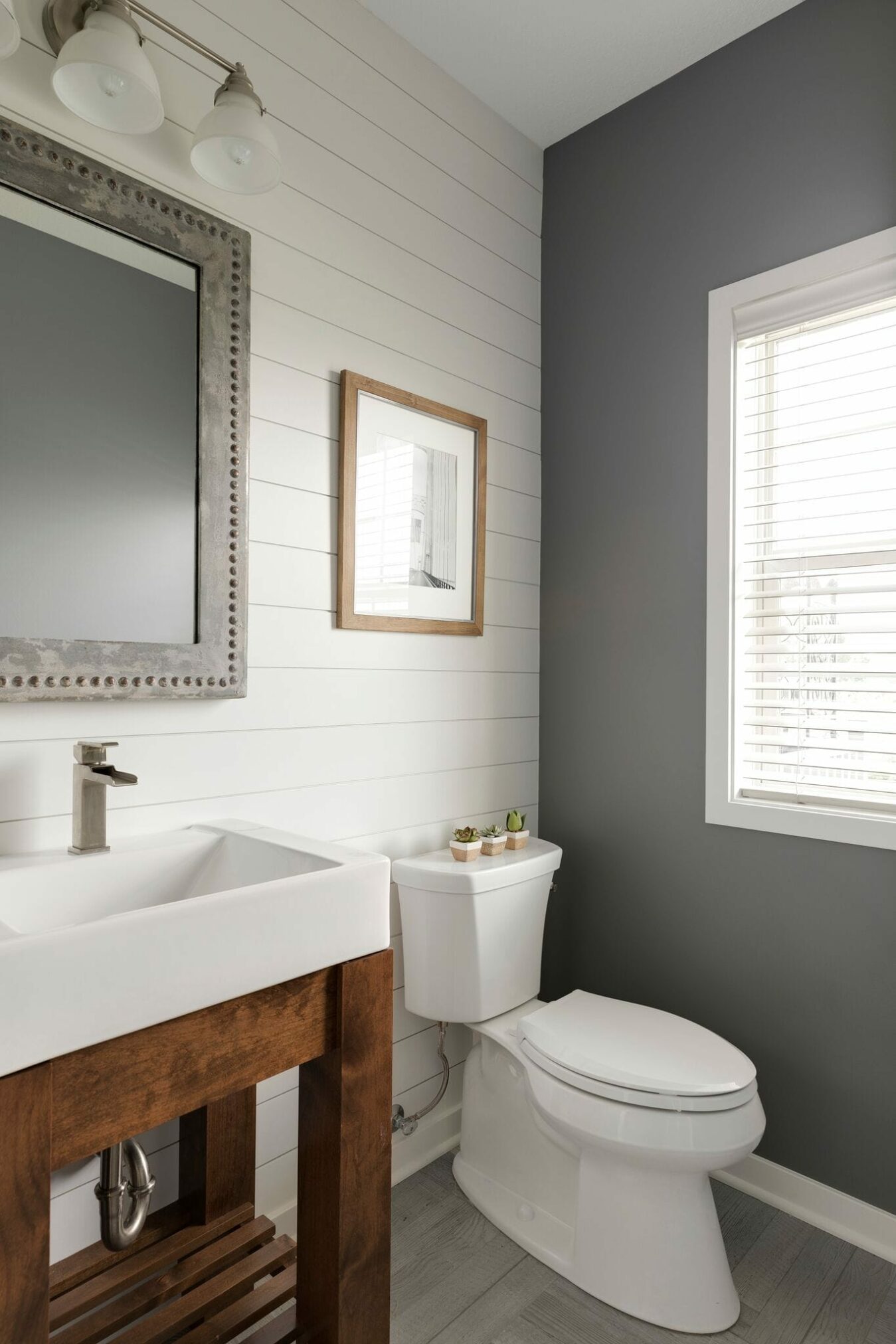 Gray and white walls in a powder room remodel, part of Parade of Homes in 2018.
