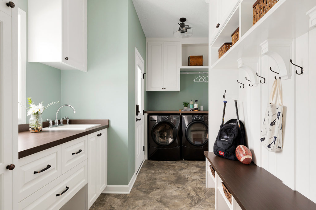 Mudroom/laundry room with green walls