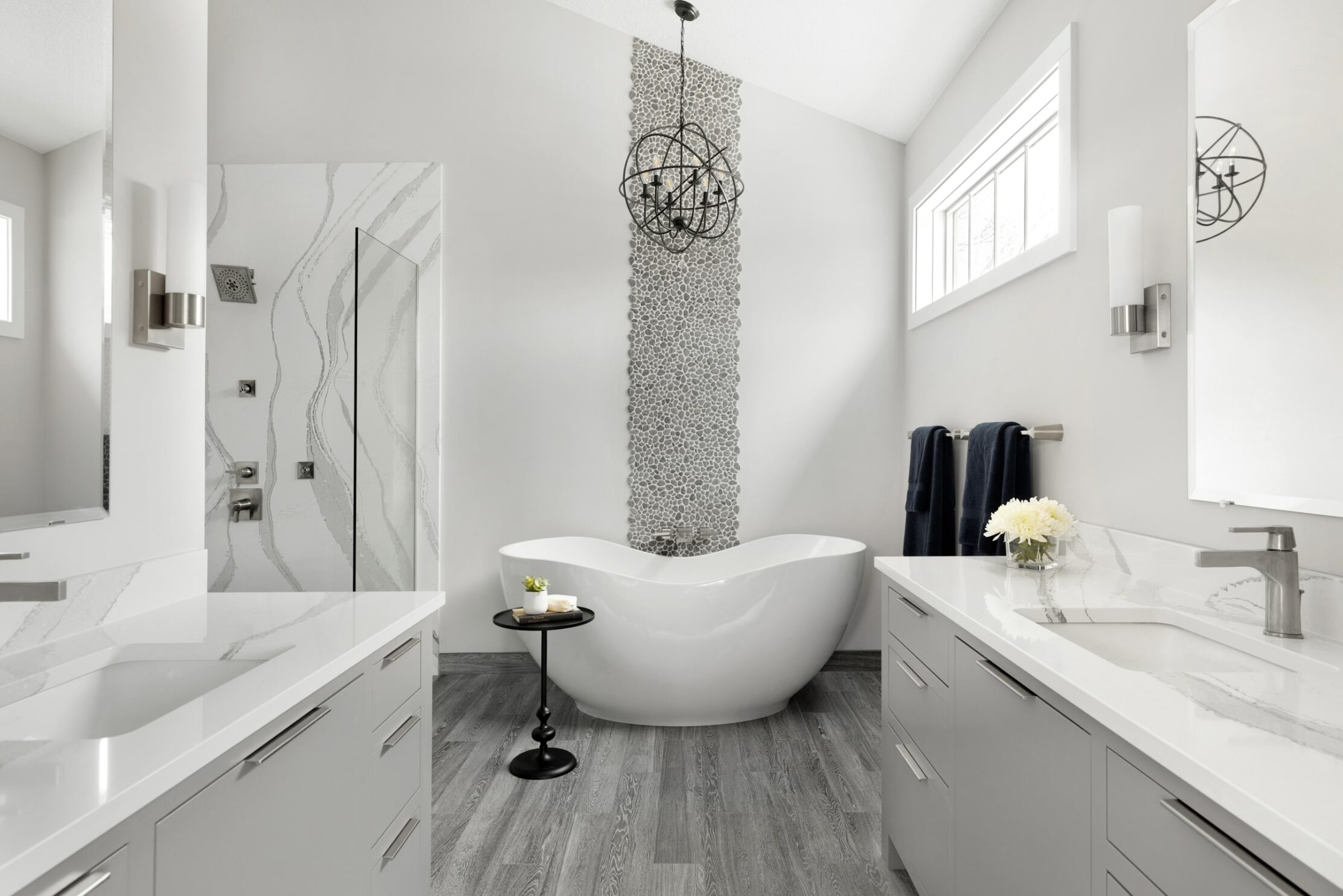 Luxurious bathroom with a unique tile wall feature