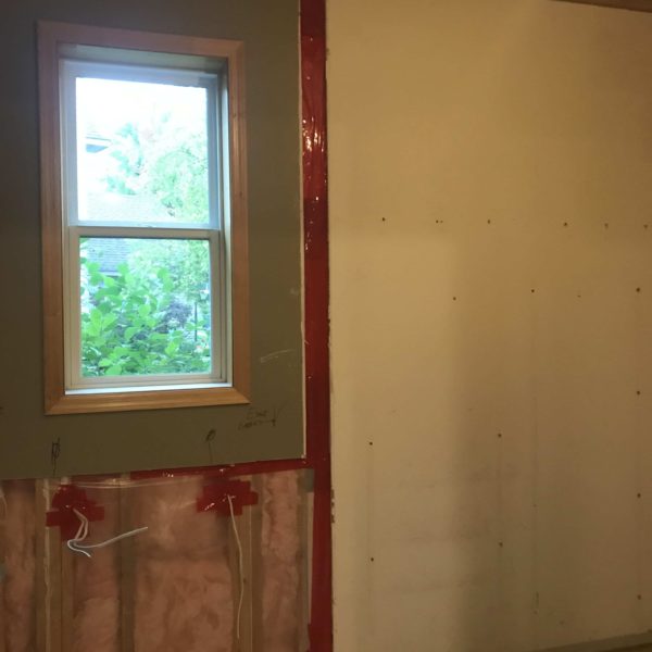 A partially torn down wall during a remodel