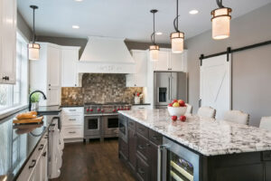 Kitchen with island countertop and light fixtures.