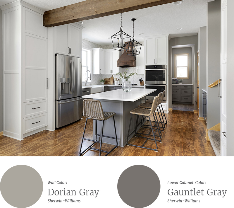 Remodeled kitchen with gray painted accents and hardwood floors. 
