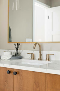 A modern vanity sink with marble countertop