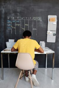 Kid working on homework in their study area.