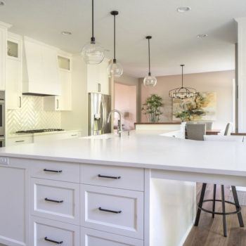 Kitchen with light cabinets and natural lighting.