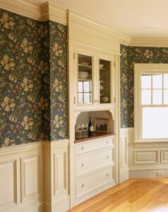 Traditional raised millwork with floral wallpaper above;