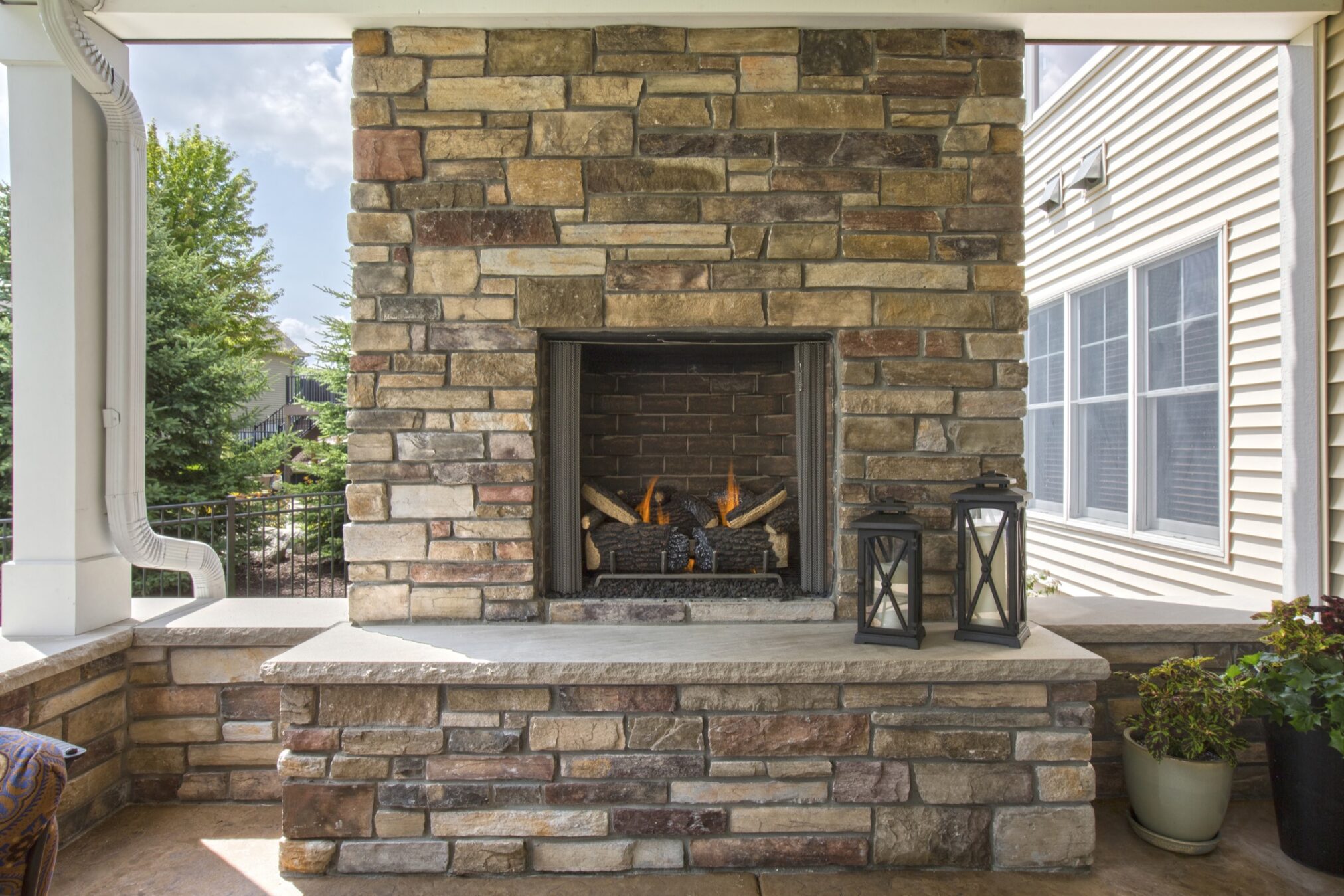 Outdoor fireplace with stone.