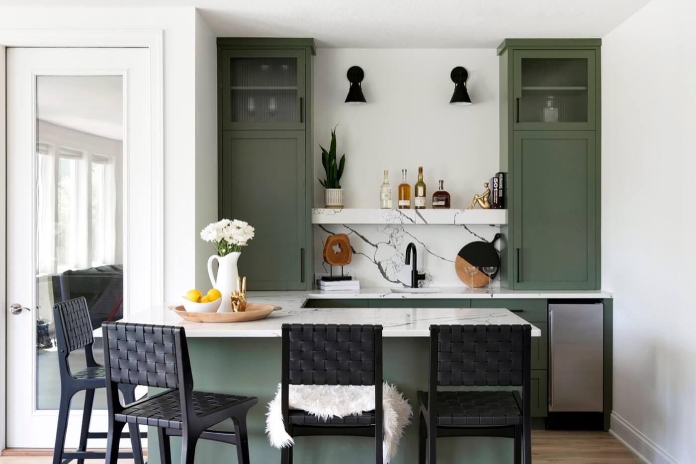 A dining area with contrasting green and white