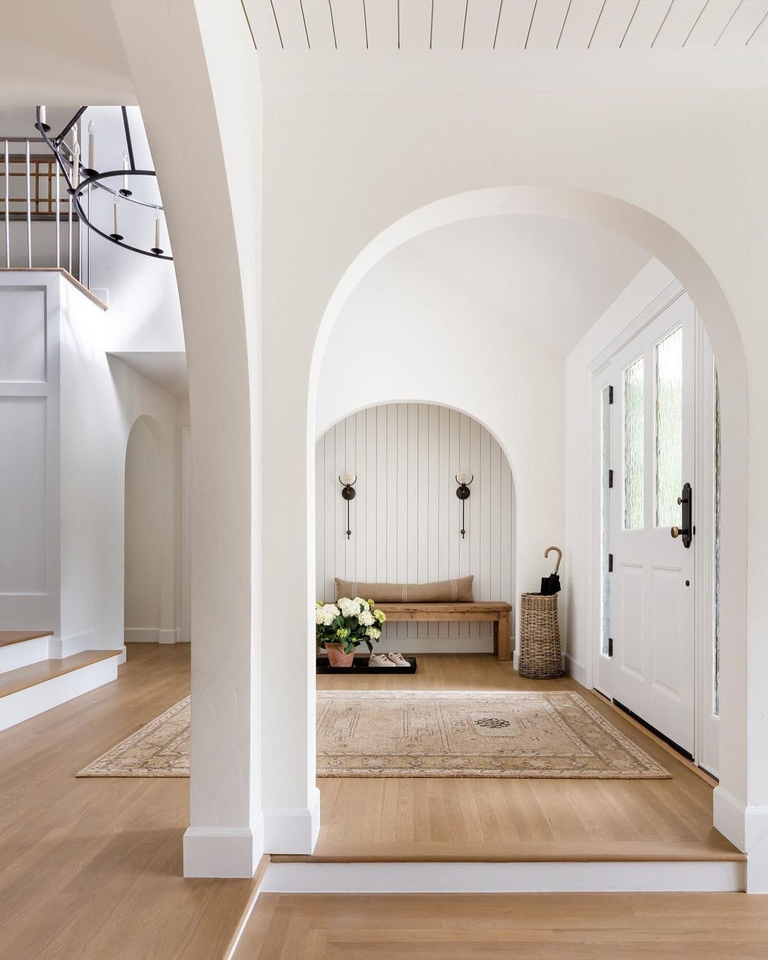 White arched doorway in house entrance.