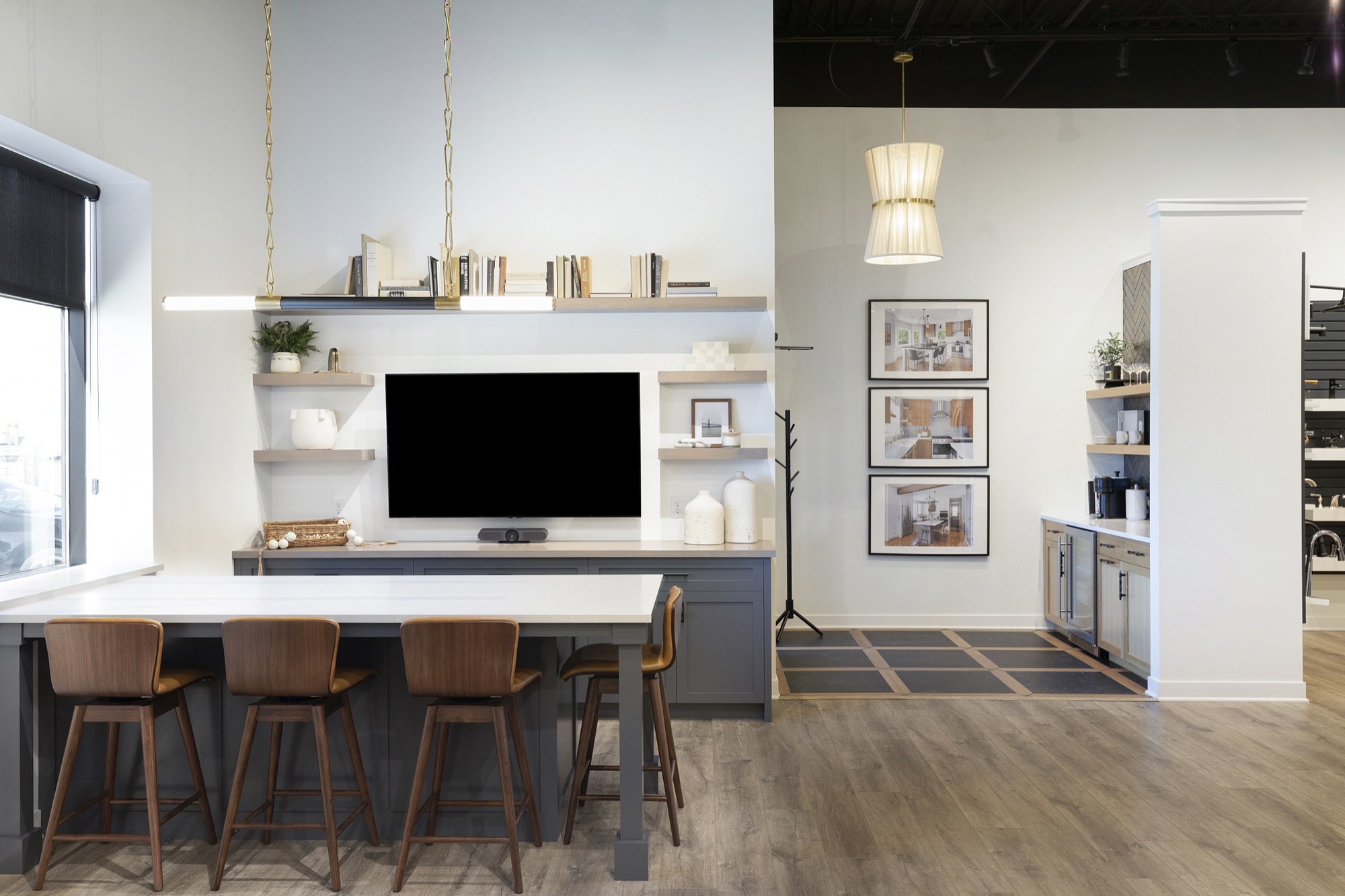 Remodeling showroom with presentation area including TV screen and chairs.