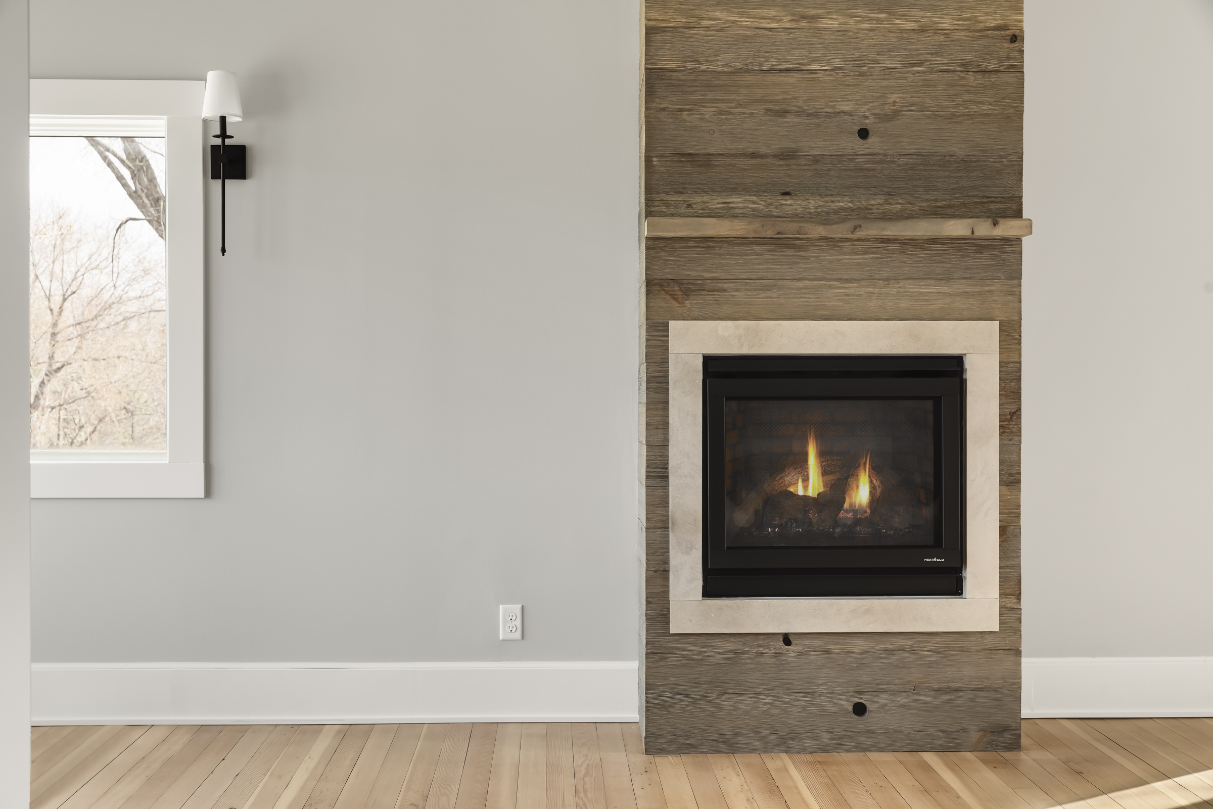 New Heat & Glo gas fireplace with Forever Barnwood weathered barn wood. 