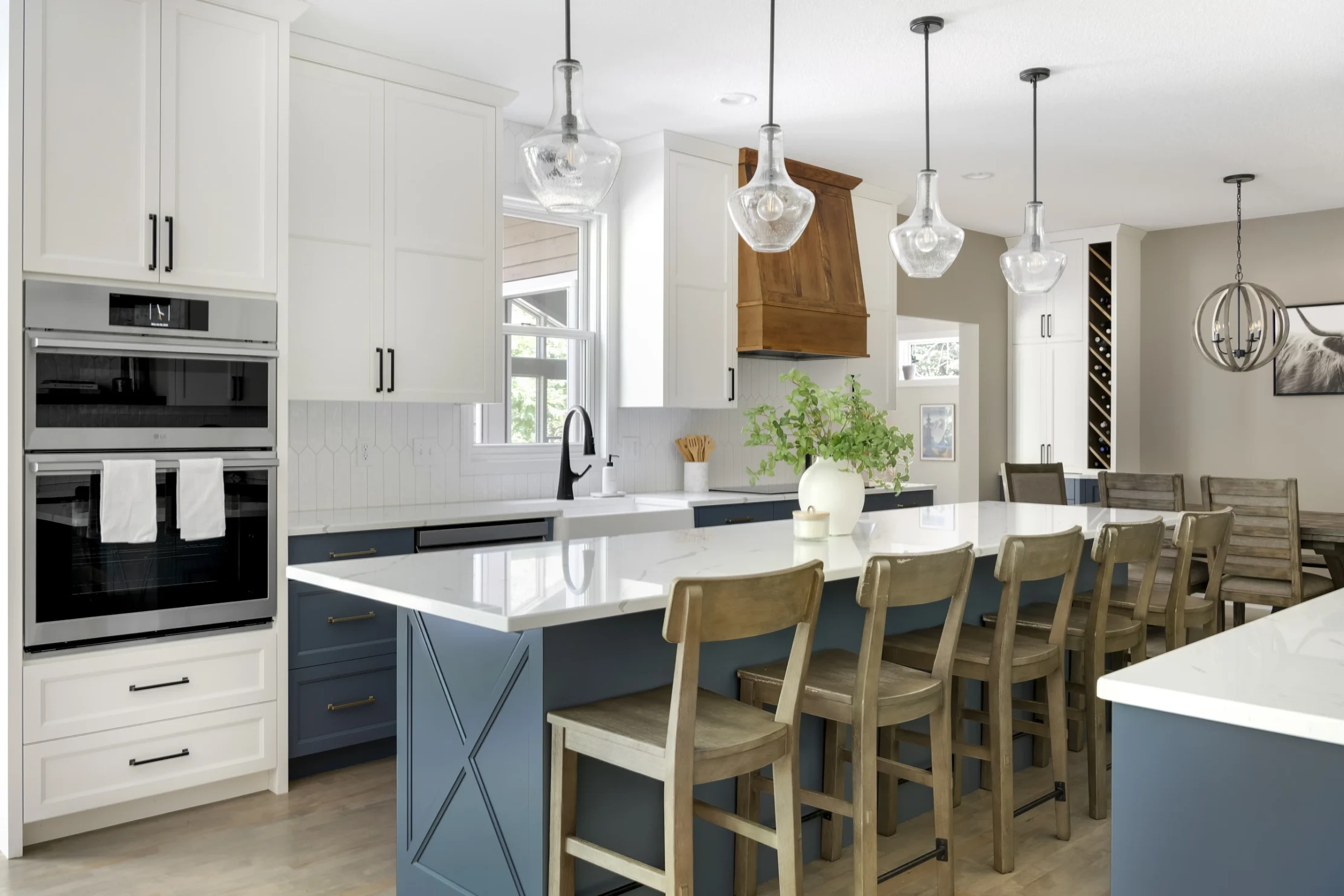 Modern remodeled kitchen with blue accent cabinets and white upper cabinets