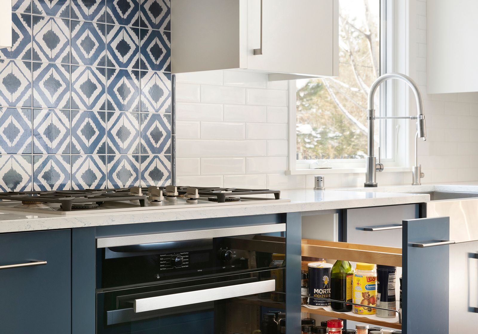 Minneapolis-Kitchen-Designers2 Minneapolis kitchen remodel with white and blue custom cabinets and pullout drawer.