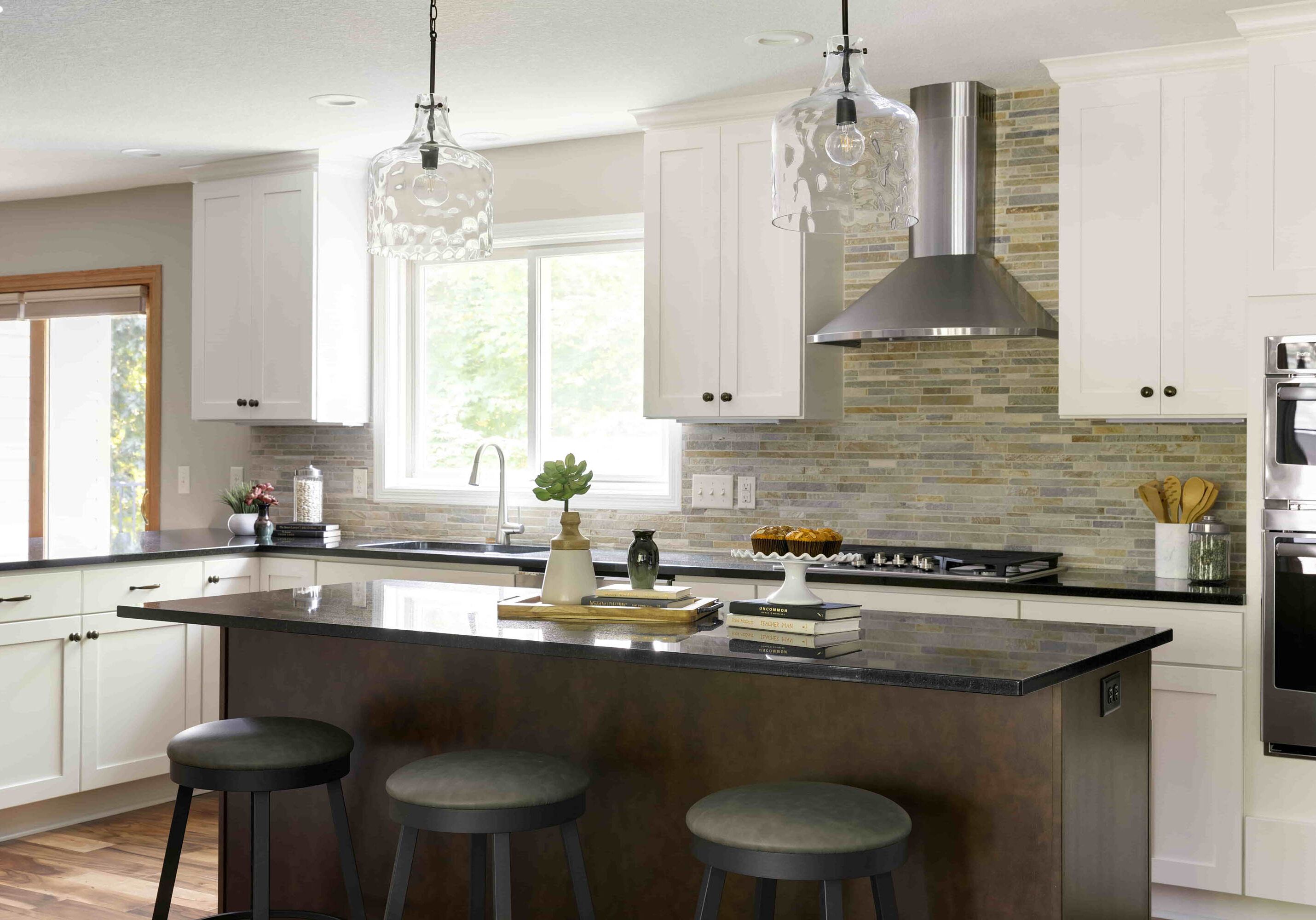 Rosemount-DA-001-min-1 Modern kitchen with black countertops and white cabinets